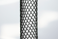Heavy Duty, black plastic protective netting, stretched over a tube.