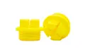 Two yellow plastic Metric Threaded plugs with a hex shaped head and recessed cross.