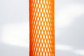 Heavy Duty, grey plastic protective netting, stretched over a tube.