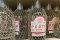 Bottles of Gin, covered in plastic protective netting.