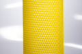 Heavy Duty, yellow plastic protective netting, stretched over a tube.