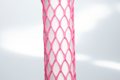 High Stretch, pink plastic protective netting, stretched over a tube.