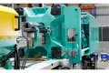 Arburg injection moulded machine from one end.