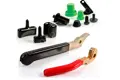 Plastic coated handles in red and black PVC, with some plastic components behind.