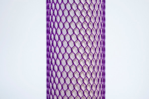 Purple plastic protective netting, stretched over a tube.