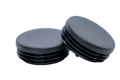 Two black plastic round tube inserts. One is at an angle on top of the other