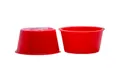 Two red plastic tapered plugs. Opposite ways up.