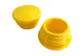 Pair of yellow plastic plugs for scaffold protection.