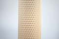 Heavy Duty, red plastic protective netting, stretched over a tube.
