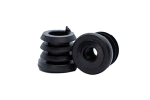 Two black plastic round tube inserts, with a threaded hole. One standing up and the other on its side showing the threaded hole.