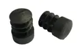 Angled view of two thick, robust, round black plastic injection moulded tube insert feet.