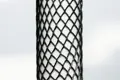 black plastic protective netting, stretched over a tube.