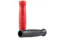 Side view of two glossy plastic dimple grips. One red one standing up and one black one on its side.
