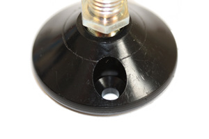 Close up view of the mounting hole on the base of a tilt and glide adjustable foot.