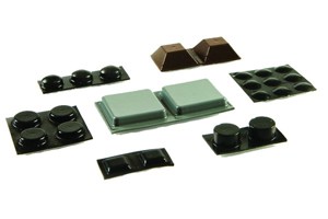 Selection of different shaped self adhesive feet. Domed, square, cylindrical and hemispherical. In black, grey and brown.