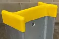 Close up of I shaped yellow pvc cap on top of galvenised I shaped metal post.