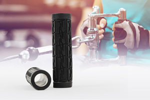 Side view of two black plastic patterned industrial grips with a backdrop showing their application on the handle of an exercise machine.