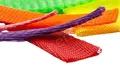 A selection of plastic protecting netting. In various sizes. Pink, Purple, Orange, Red, Yellow and Green.