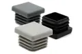 Angled view of three square LDPE injection-moulded insert feet: one black, one mid-grey, and one light grey.