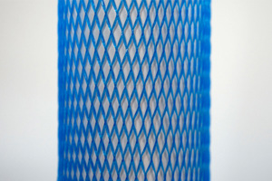 Blue plastic protective netting, stretched over a tube.