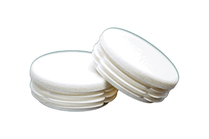 Two white plastic round tube inserts. One is at an angle on top of the other.