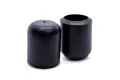 Side view of two black straight-sided injection moulded chair feet. One facing up, one facing down.
