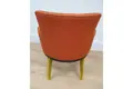 A chair with yellow protective netting covering the chair legs